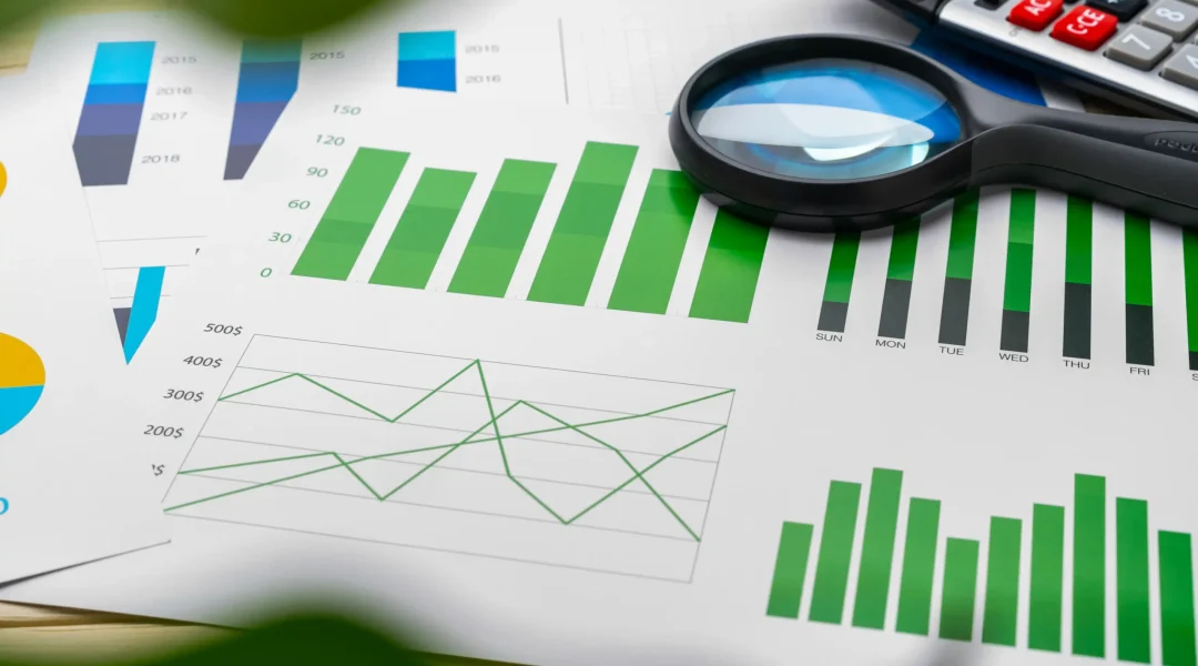 business-graphs-and-magnifying-glass-on-table-2025-02-24-16-48-20-utc